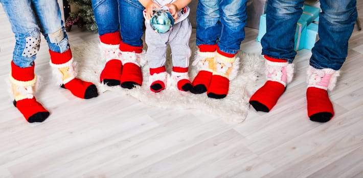Happy family with Christmas socks. Winter holiday concept. Three children