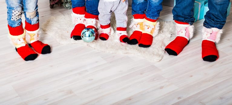 Happy family with Christmas socks. Winter holiday concept. Three children