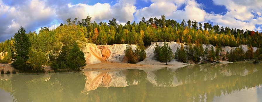 Beautiful colourful autumn landscape. Nature with forest and colourful trees in autumn. Concept for the season and the environment. 