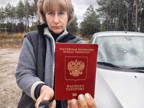 Driver girl with Russian passport and car. Russian cars banned for entering in Europe. Russian tourism closed during war of Russia and Uk. Confiscation of Russian car and sanctions against Russians