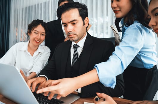 Diverse of business people from various ethnic group working in modern office environment. Productive and multi ethnic office workers engage in discussion for strategic business marketing. Habiliment