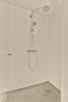 a bathroom with white tiles on the wall and shower head mounted to the wall in front of the bathtub