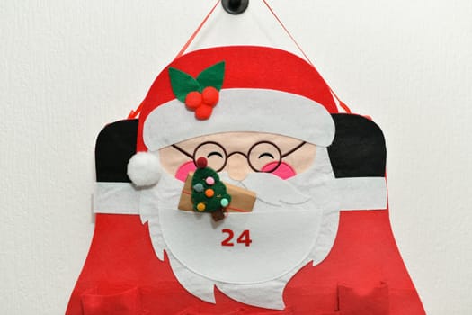 Felt santa claus advent calendar with gifts
