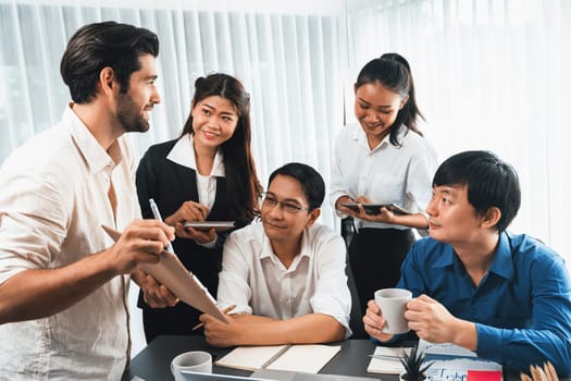 Group of diverse office worker employee working together on strategic business marketing planning in corporate office room. Positive teamwork in business workplace concept. Prudent