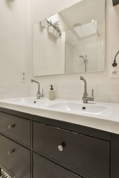 a bathroom with two sinks and a mirror on the wall behind it is a zebra print rug in the floor