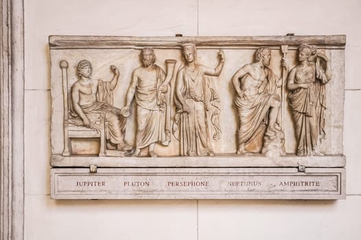 Rome, Italy, August 24, 2008: Relief with Roman Gods. From left to right: Jupiter, Pluto, Persephone, Neptune and Amphitrite. Altemps Palace