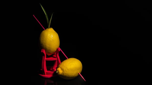 Creative still life with lemons on a black background
