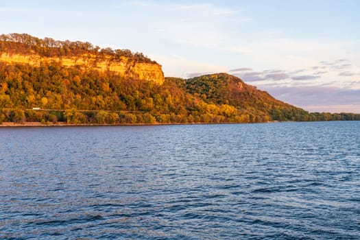 Cliffs at sunset of Maiden Rocks Bluff state natural area in Winsconsin seen from Mississippi river