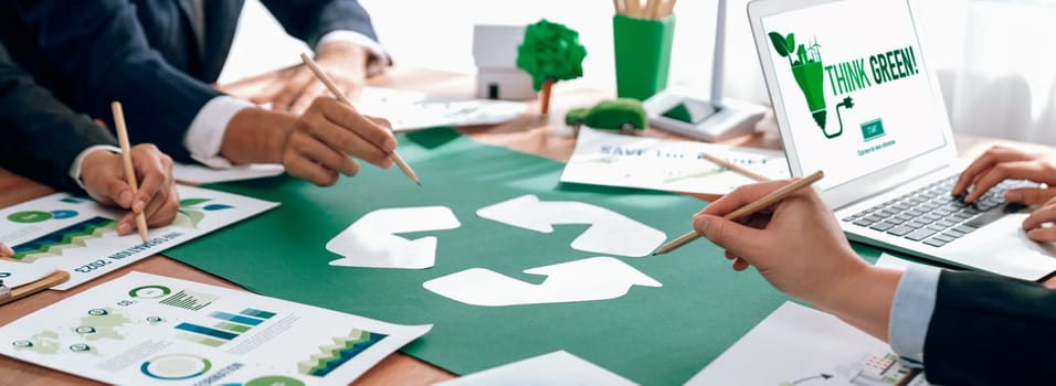 Group of business people planning and discussing on recycle reduce reuse policy symbol in office meeting room. Green business company with eco-friendly waste management regulation concept.Trailblazing