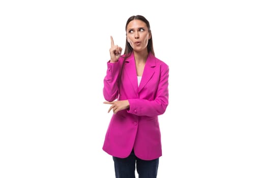 young business assistant woman with black flowing hair wears a bright crimson jacket to work.