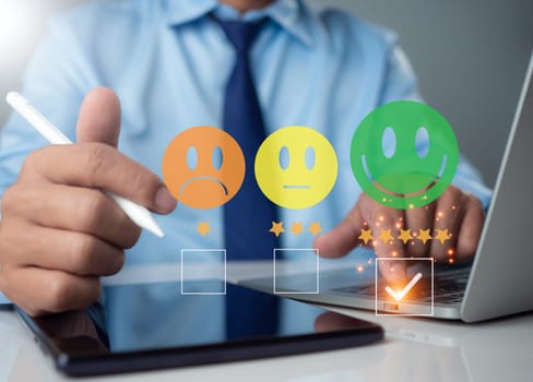 Customer satisfaction survey concept, online service experience, businessman is evaluating customer product service quality and reviewing satisfaction feedback.