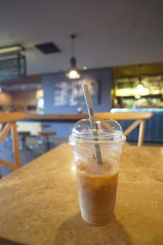 iced late in a transparent glass on cafe table outdoor ,