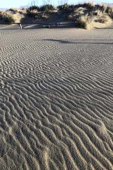 Photographic documentation of the sand smoothed and drawn by the strong wind 