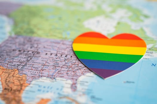 Bangkok, Thailand, June 1, 2022 Rainbow color heart on USA America globe world map background, LGBT pride month.