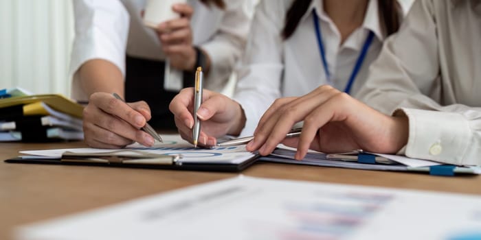 businesswoman hand hold pen and point at document to brainstorm about static.