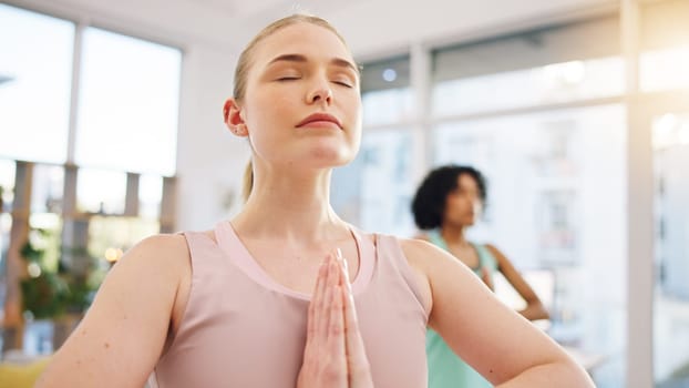 Meditation, yoga and wellness with woman in class for peace, fitness or spiritual health. Balance, mindfulness and zen with person and relax in studio for holistic, breathing and energy training.