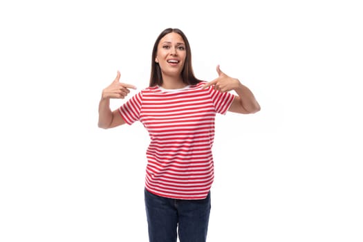 young pretty smiling european woman with straight black hair is wearing a striped red t-shirt.