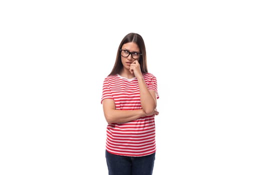 pretty 35 year old european lady in a red striped t-shirt wears glasses for vision correction on a white background with copy space.