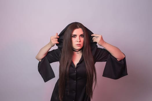 Gothic young beautiful woman in witch halloween costume