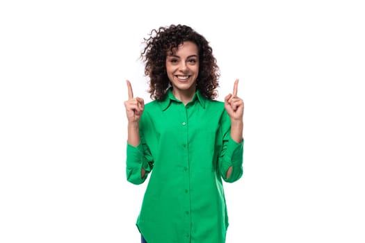 young employee of the company woman with black hair dressed in a green shirt feels joy and happiness. people lifestyle concept.