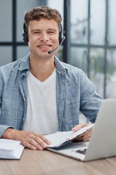 man, call center and web support communication at a computer in a office