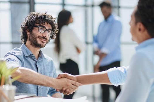 Business professionals in a successful meeting, displaying teamwork and collaboration.