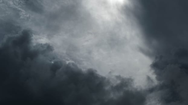 Black and white tones of the sky on a rainy day. Aerial view of the sky and black clouds. Dark grey storm clouds. Dramatic sky before the storm.