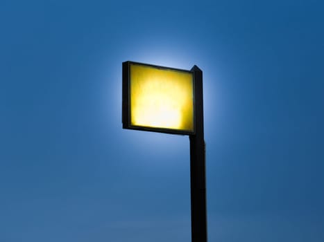 Spotlights tower with blue sky background.