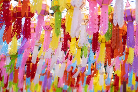 Colorful Lanna paper lanterns hang in Lamphun temples. Popular lantern festival during Loy Krathong in northern Thailand. Traditional Yi Peng paper lantern.