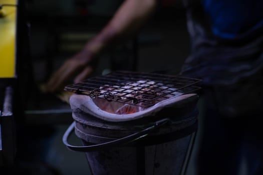 Dried squid grilled over traditional charcoal stove. Famous street food menu in Asia.