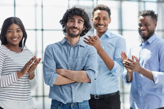 Diverse group engaged in productive business meeting, displaying cooperation and teamwork.