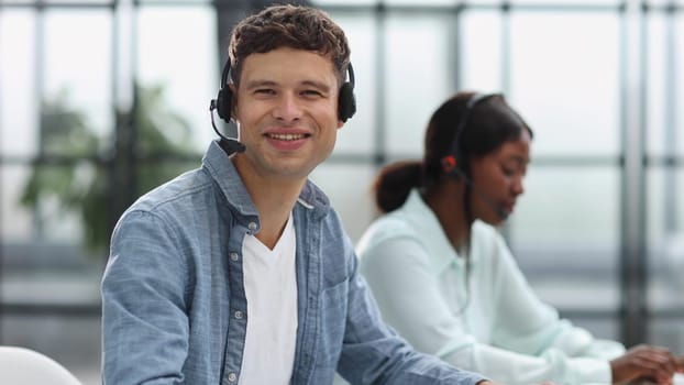 operators woman and man agent with headsets working in a call center.