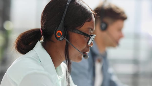 operators woman and man agent with headsets working in a call center.