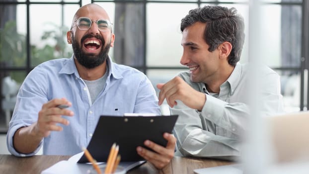 man working on the table with laptop in a new office