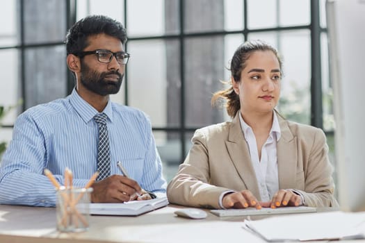 Startup business partners working together in desktop