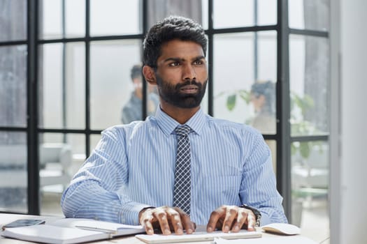 Stylish designer at work sitting. Focused on his job