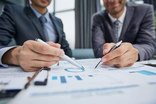 two businessmen watching a growth chart close-up