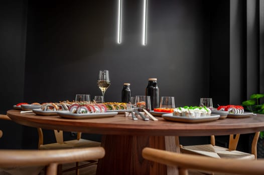 A set of sushi rolls on a table in a restaurant. High quality photo.