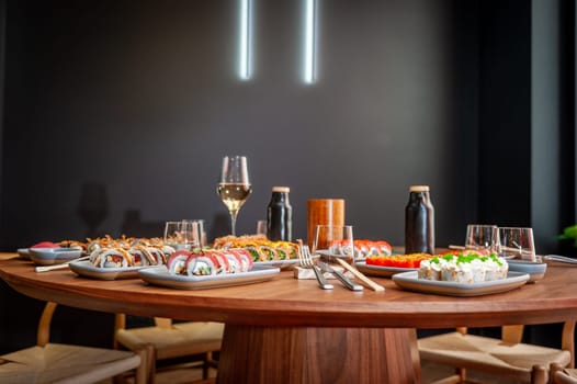 A set of sushi rolls on a table in a restaurant. High quality photo.