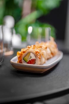 Classic Bonito sushi roll set with tuna flakes, salmon and avocado. Japanese dish of fresh salmon and rice. High quality photo