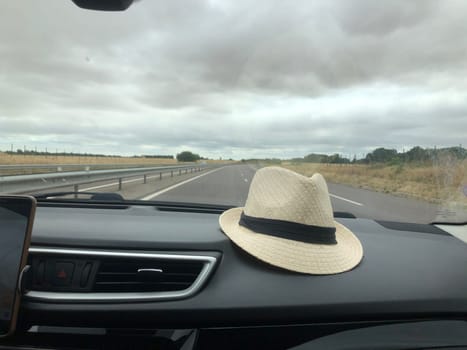 A hat in the car Rural landscape outdoor the window