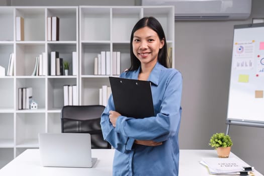 Businesswoman doing finance, documents. Mathematics clipboard on table in office and business background, tax, accounting, statistics and analytical research concept..