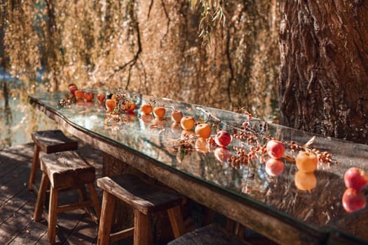 Apples on a glass table in nature