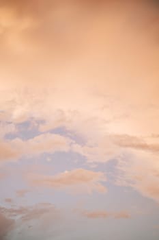 Pink clouds in the sunset sky. Bottom view. High quality photo