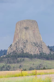Cloudy days seeing Devils Tower in the summer . High quality photo