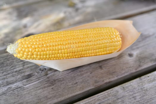 Corn in a wooden barbecue box
