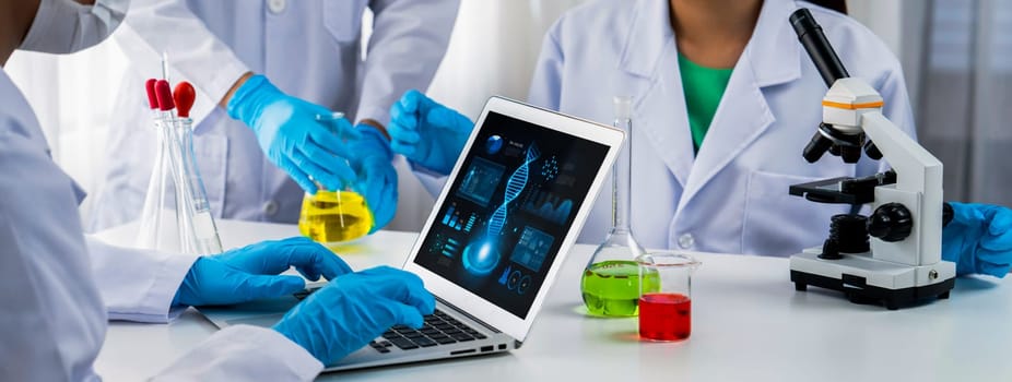 Laboratory research team advance healthcare with scientific expertise, laboratory equipment, and innovative medical biotechnology software, researching new medicines and developing cure.Panorama Rigid