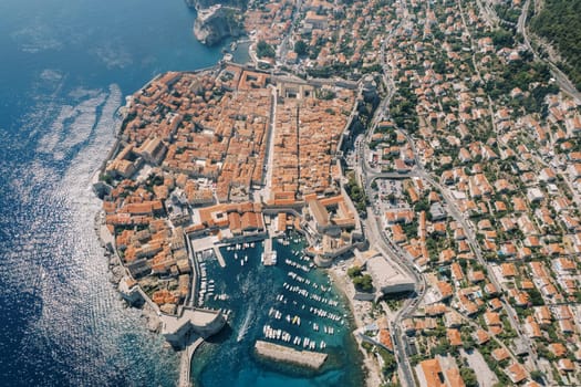 Old town of Dubrovnik with fortress walls and port. Croatia. Aerial view. High quality photo