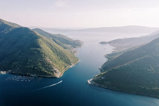 Panoramic view from a drone of the Bay of Kotor among green mountains. Montenegro. High quality photo