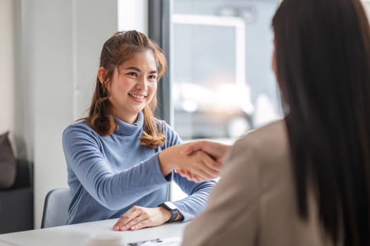 Young businesswoman discussing an offer of a collaboration and a successful deal..